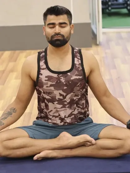 Seated in Siddhasana, the Accomplished Pose, for meditation. This posture helps to direct energy upward along the spine, making it a powerful asana for longer periods of quiet contemplation and self-realization.