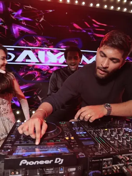 For me, DJing isn't just about playing music; it's about connecting with everyone. Here I am showing the bride the ropes at her own wedding party. It’s these interactive moments that make a celebration unforgettable.