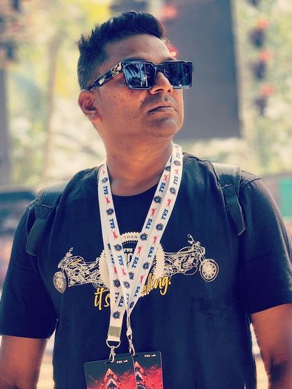 A photo from a festival, wearing my artist pass. These events are a great way to connect with other artists and my music family.