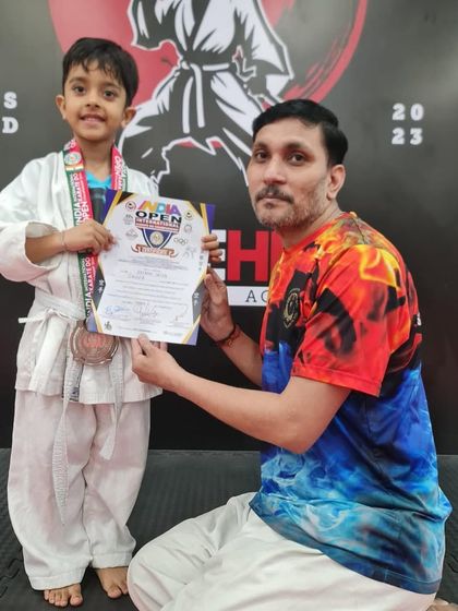 Another one of our young students with his medal after competing. We are incredibly proud of all our little strikehivers.