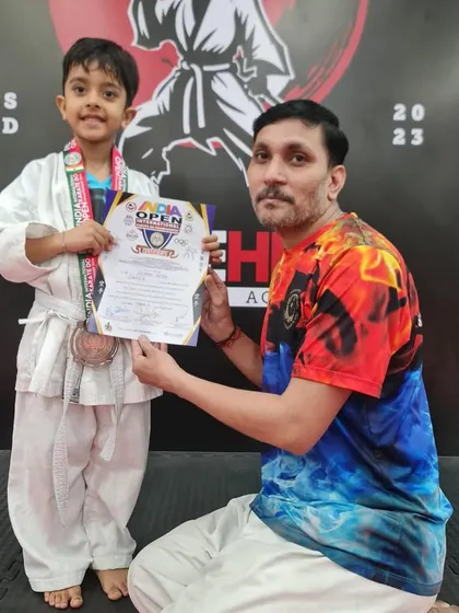 Another one of our young students with his medal after competing. We are incredibly proud of all our little strikehivers.