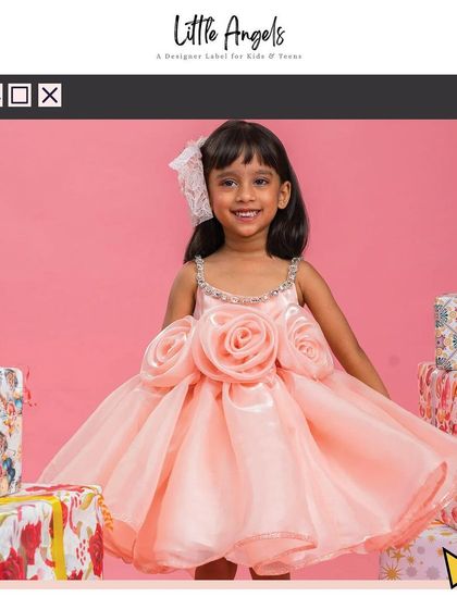 Our "Flower Dress" in peach, featuring large 3D roses and a voluminous organza skirt.