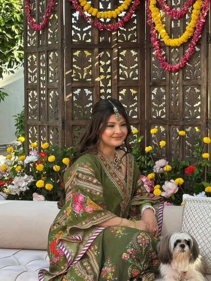 A serene moment with the bride and her furry friend. Even the pet seems to be admiring the beautiful mehandi.