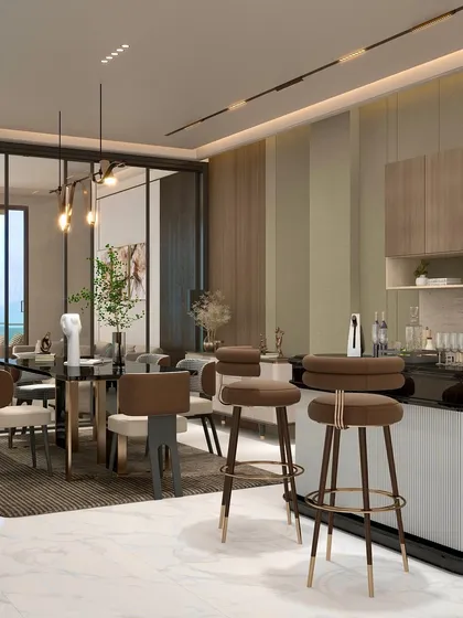 The open plan layout of the Chattarpur farmhouse integrates the dining and bar area with the living space. This encourages social interaction while maintaining distinct functional zones.