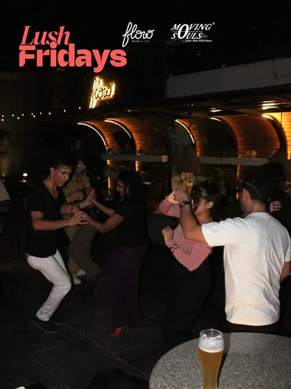 A snapshot of the social dancing in full swing. You can see multiple couples dancing, enjoying the music and the casual, friendly atmosphere of our open-air party.
