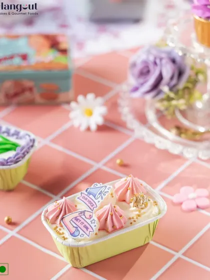 This Women's Day bar cake is a delightful treat. Topped with empowering messages and beautiful piping, it's a perfect way to make her smile.