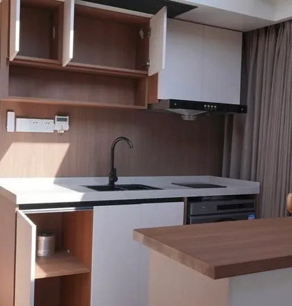 The compact and modern kitchenette inside the Space Capsule E8. It comes fully equipped with a sink, cooktop, and chimney, demonstrating the smart use of space in our futuristic designs.