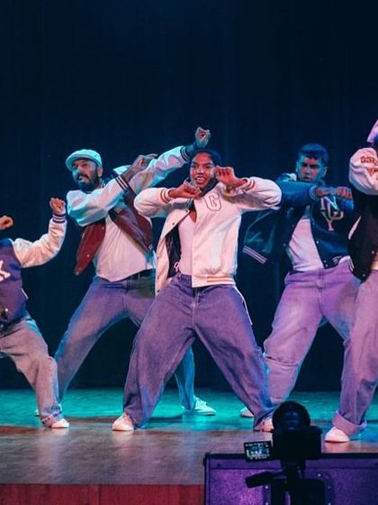 The instructors hit a powerful pose, demonstrating the skill and artistry that they pass on to every student in our performance batches.