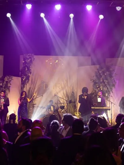 We on stage, ready to bring the house down. A great performance is about more than just music; it's about professional sound, dynamic lighting, and creating a complete sensory experience for your wedding guests.