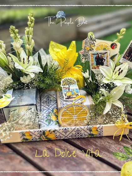 A birthday story of "La Dolce Vita" for a chai connoisseur. This artisanal hamper blends the charm of Italy with the fragrance of fresh lilies and rajnigandha, personalized with photos to capture the warmth of a special friendship.
