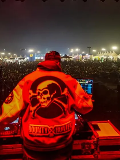 A view from my DJ console, bathed in red light, as I look out over the festival grounds. This is my zone.