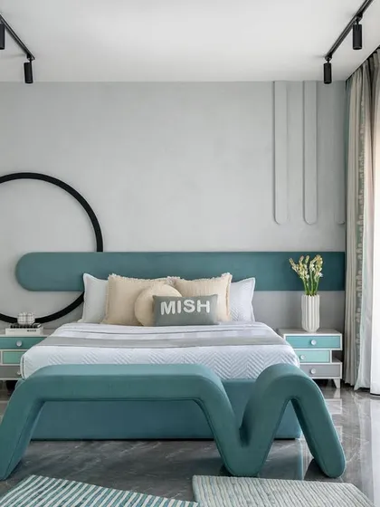 A wide view of the kids' bedroom, showcasing the custom bed with its unique "M" shaped bench, the circular wall art, and the ample natural light. The room is designed to be a sanctuary for a child to flourish.