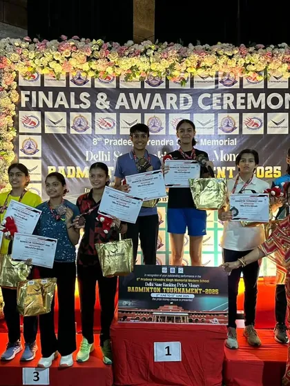 The girls' podium at the Delhi State 2025 finals. Alina and her partner stand tall with their gold medals, a proud moment for the entire academy.