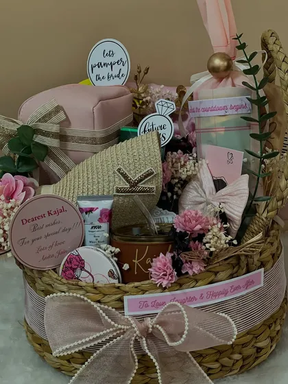 Let's pamper the bride. This gorgeous basket is overflowing with personalized goodies for Kajal, including a custom tumbler, a jewelry box, and other self-care treats to help her relax before the big day.