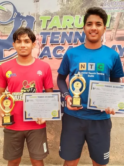 NTC players Manan Kumar and Arjun Bhati as winners of the CS-7 U-18 Boys Doubles tournament.