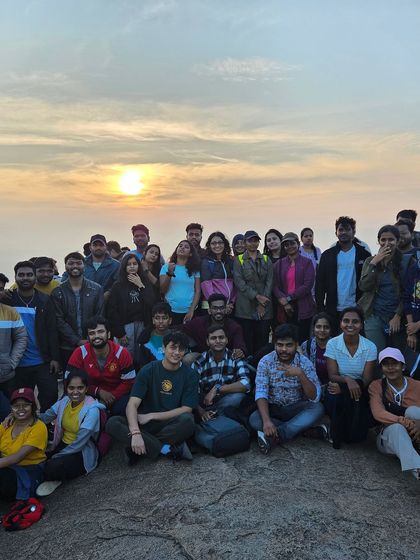 A large group photo with the rising sun at Uttari Betta. This is what our Sunday mornings look like.