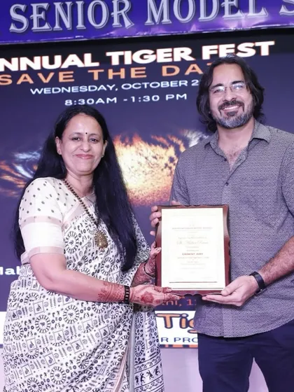 Receiving a certificate of appreciation for my participation in the school's Annual Tiger Fest. It is always an honor to be recognized for contributing to community and educational events through my art.