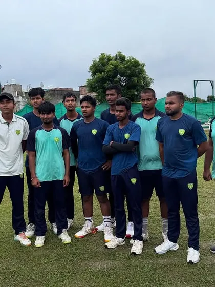 A team huddle before a practice session. Our coaches use these moments to instill strategic thinking and reinforce the importance of discipline and listening, key traits of a successful cricketer.