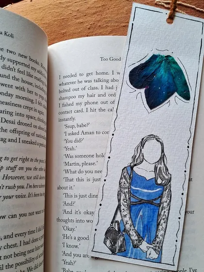 The back of a custom bookmark, showing a simple illustration of a person with a pop of color. Even the back can tell a part of the story.