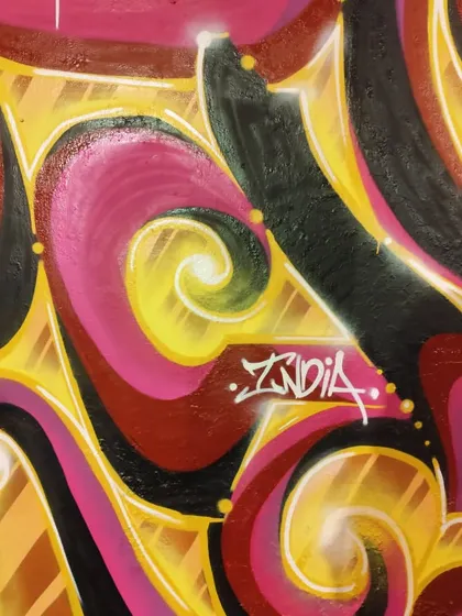 A close-up of the Masala Flow piece in Malaysia. The glowing effect on the letters makes them look like they're lit from within.