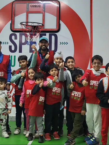 Our young guns. A group of our enthusiastic kids posing with their coaches, ready to take on any challenge.