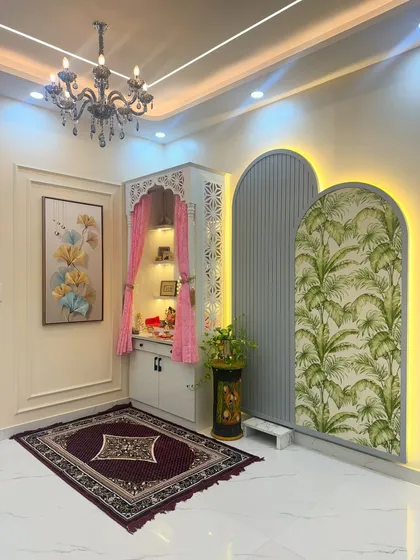 Creating a peaceful corner for prayer and reflection is a special part of my work. This custom-designed pooja unit integrates intricate jali work, soft backlighting, and elegant storage to create a space that feels both divine and harmonious with the home's decor.