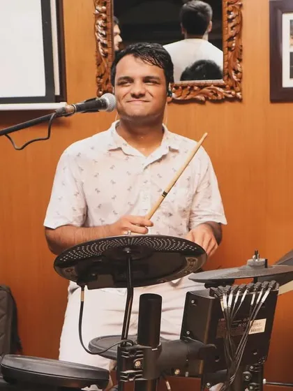 Our drummer Leander, all smiles behind his kit. A happy drummer means a groovy beat, and he always delivers.