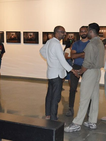 The artist interacting with visitors.