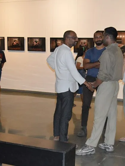 The artist in conversation with guests at his solo show preview.