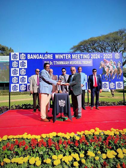A moment of celebration for the winner of the Dr. T. Thimmaiah Memorial Trophy.