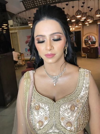 A view with eyes closed to showcase the clean and blended eyeshadow work. I used a mix of matte and shimmer shades for a multi-dimensional effect.