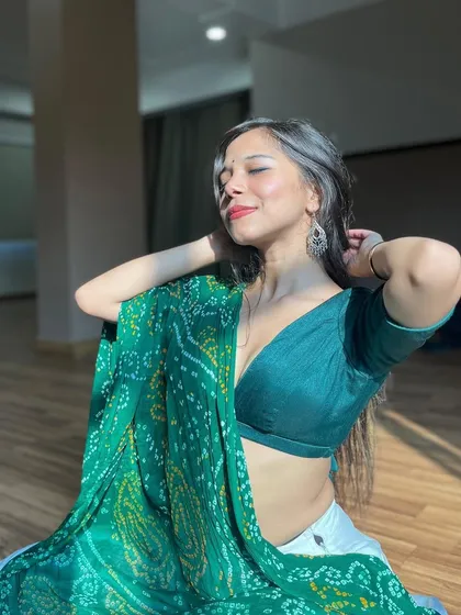 A sun-kissed portrait with eyes closed, feeling the moment and the music.