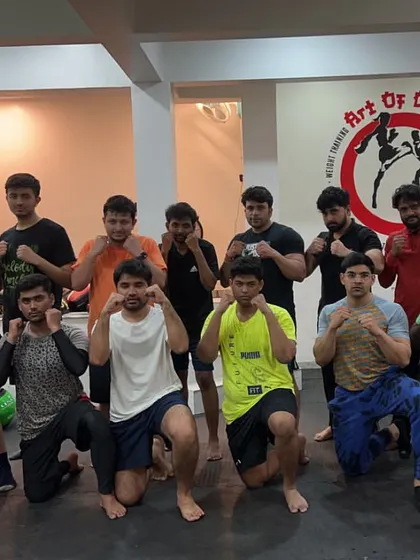 The next generation of fighters, posing with their coaches and teammates.