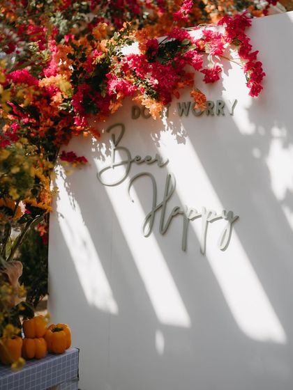"Don't Worry, Beer Happy." A fun and quirky sign at the beer garden, perfectly capturing the laid-back and celebratory mood of the Mehendi.