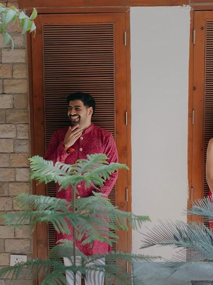 A candid shot of Chirag and Ipsa sharing a laugh. These are the unscripted moments of connection that we love to capture, showing the couple's natural chemistry.