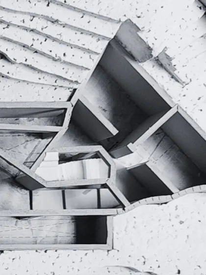 A cross-section view of the hillside study model. This perspective reveals the multi-level design, showing how the basement and other spaces are embedded within the earth to minimize the building's visual impact.