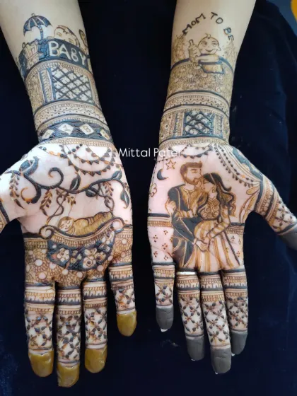 A romantic take on baby shower henna, this design includes a portrait of the expecting couple. The other hand features a baby in a cradle, with "Mom to be" and "Baby" written on the arms.