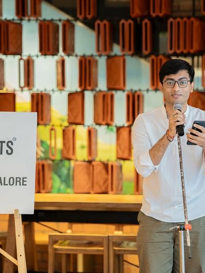 A poet shares his work at the "Seasons" themed gathering. It was a beautiful afternoon of connection and creativity.