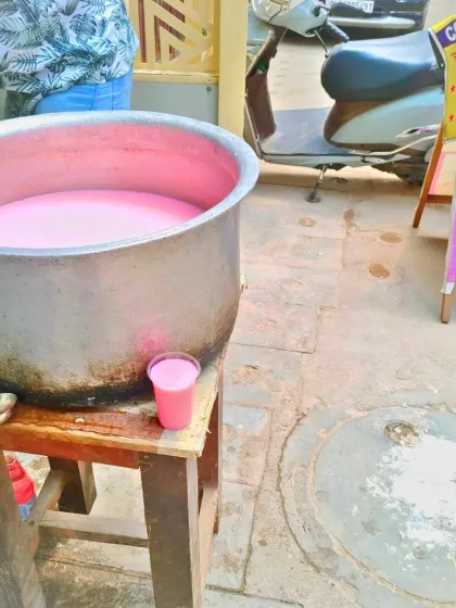 A simple glass of chilled rose sharbat, prepared in a large pot for everyone. This is the essence of Chabeel: a gesture of selfless service to quench thirst and spread smiles.