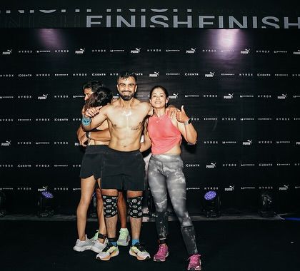 A moment of celebration with my wife and a friend after a grueling competition. Having the support of family and friends at the finish line makes all the hard work worth it.
