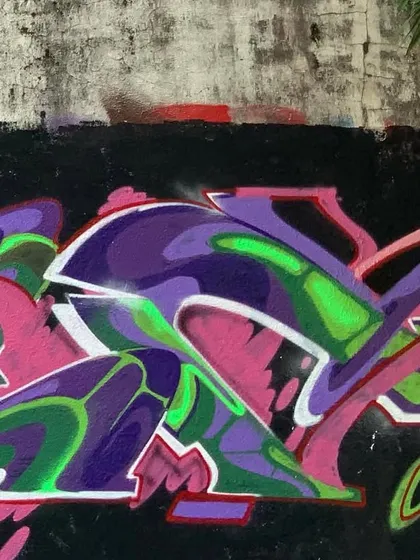 A close-up view of the wildstyle piece, showing my tag next to it. It's about creating a complex piece of art but also leaving your personal mark.