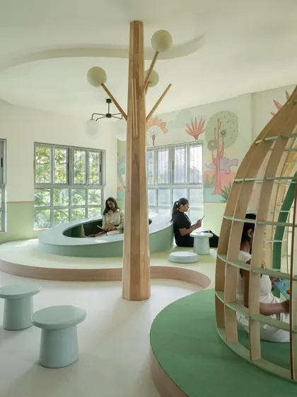 Welcome to the dream library we created for the nursery students at Sri Kumaran School. With whimsical reading pods, a central tree-like structure, and cozy, curved seating, this space is designed to make reading a magical adventure. It’s a sunlit, gentle world built to nurture bright little minds.