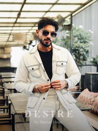 A relaxed yet confident pose in the all-white co-ord set. This look is perfect for making a sophisticated statement at any daytime event.