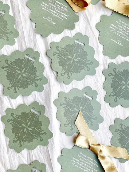 Another view of the die-cut Mehendi gift tags. These small details show a level of care and attention that guests always appreciate.