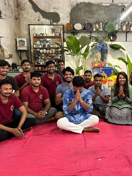 A moment of prayer and gratitude with our team after the Ganesh puja. These quiet moments of reflection are as important as the grand celebrations.