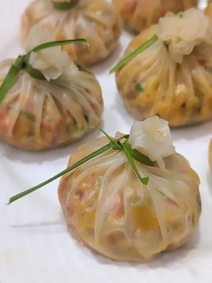 My newly launched Rice Paper Dimsums are delicate, light, and packed with flavor. These steamed dumplings are filled with finely chopped vegetables and tied with a chive, showcasing a healthier yet delicious option from my pan-Asian menu.