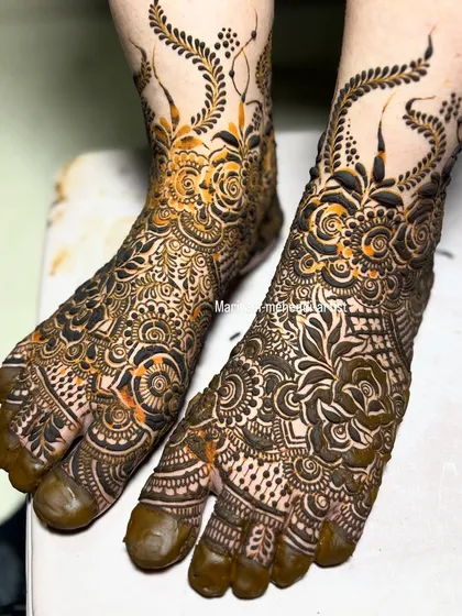 An example of my intricate bridal leg mehendi. The design flows from the ankle to the toes, incorporating delicate floral vines and traditional motifs for a complete and elegant bridal look.