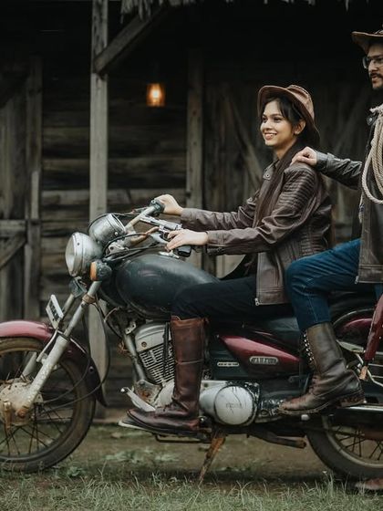 Another dynamic shot from the cowboy-themed set, featuring a vintage motorcycle and rustic barn, perfect for an adventurous couple.