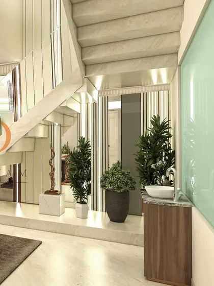 A detail of the space under the stairs, which has been thoughtfully designed with planters and a wash basin, making use of every square foot.