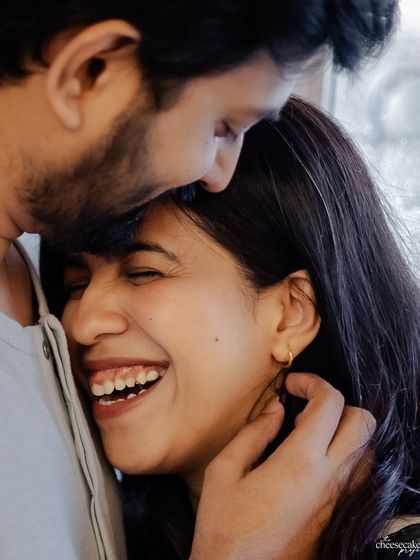 Just pure, uninhibited laughter. This is from an intimate at-home couple session, where being comfortable is key.